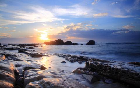 日落海洋岩石石岸阳光高清壁纸