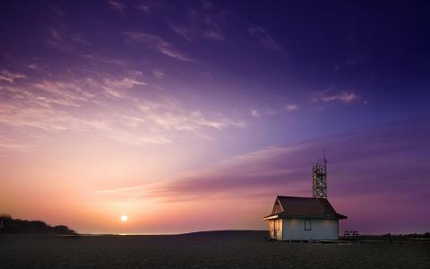 沙滩屋和紫色天空壁纸