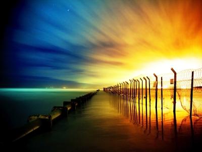 丰富多彩的栅栏日落海洋高清壁纸