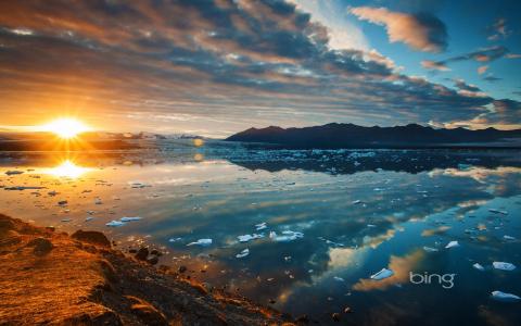 Jokulsarlon泻湖冰岛湖日落山桌面背景图像壁纸