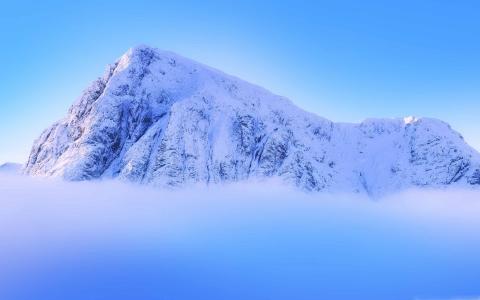 云层之上的白雪皑皑的山峰Mac壁纸